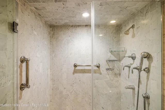 a dining room filled with furniture and a potted plant