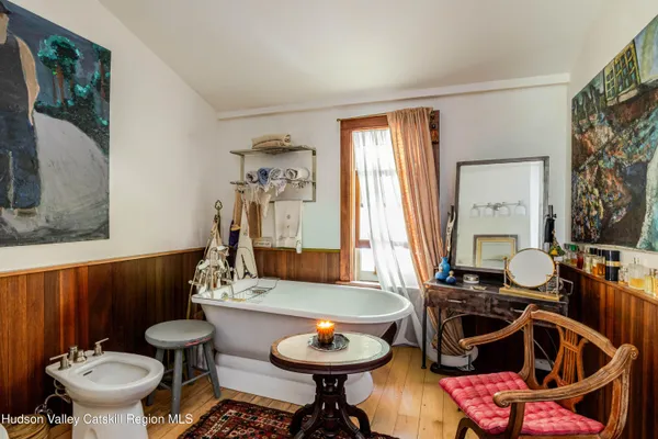 a view of a backyard with sitting area