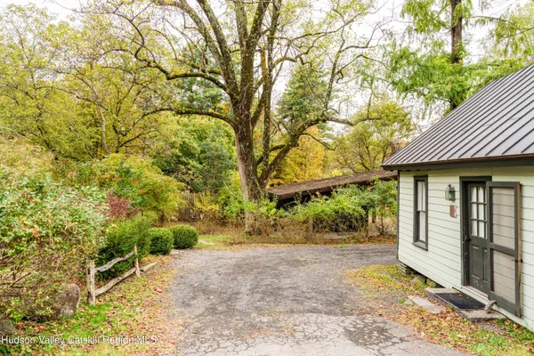 a view of a house with backyard porch and sitting area