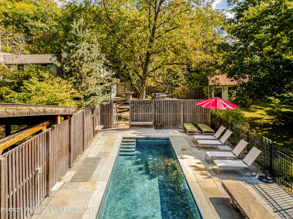 a view of a dining room with furniture and a potted plant