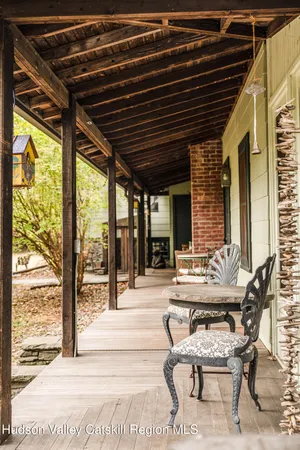 a patio with patio lots of furniture and wooden floor