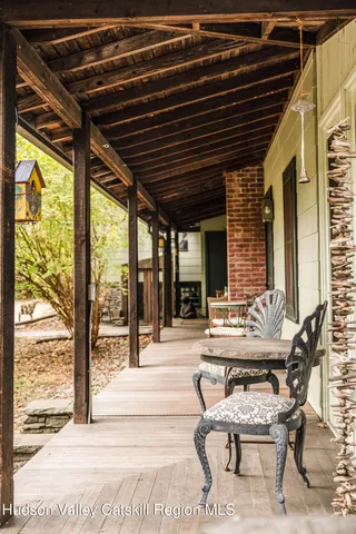 a patio with patio lots of furniture and wooden floor