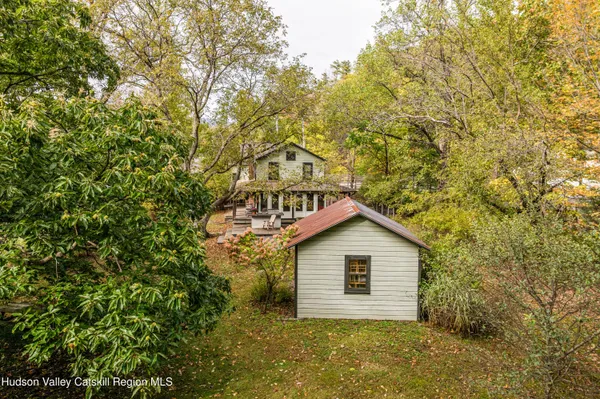 a house with a tree in front of it