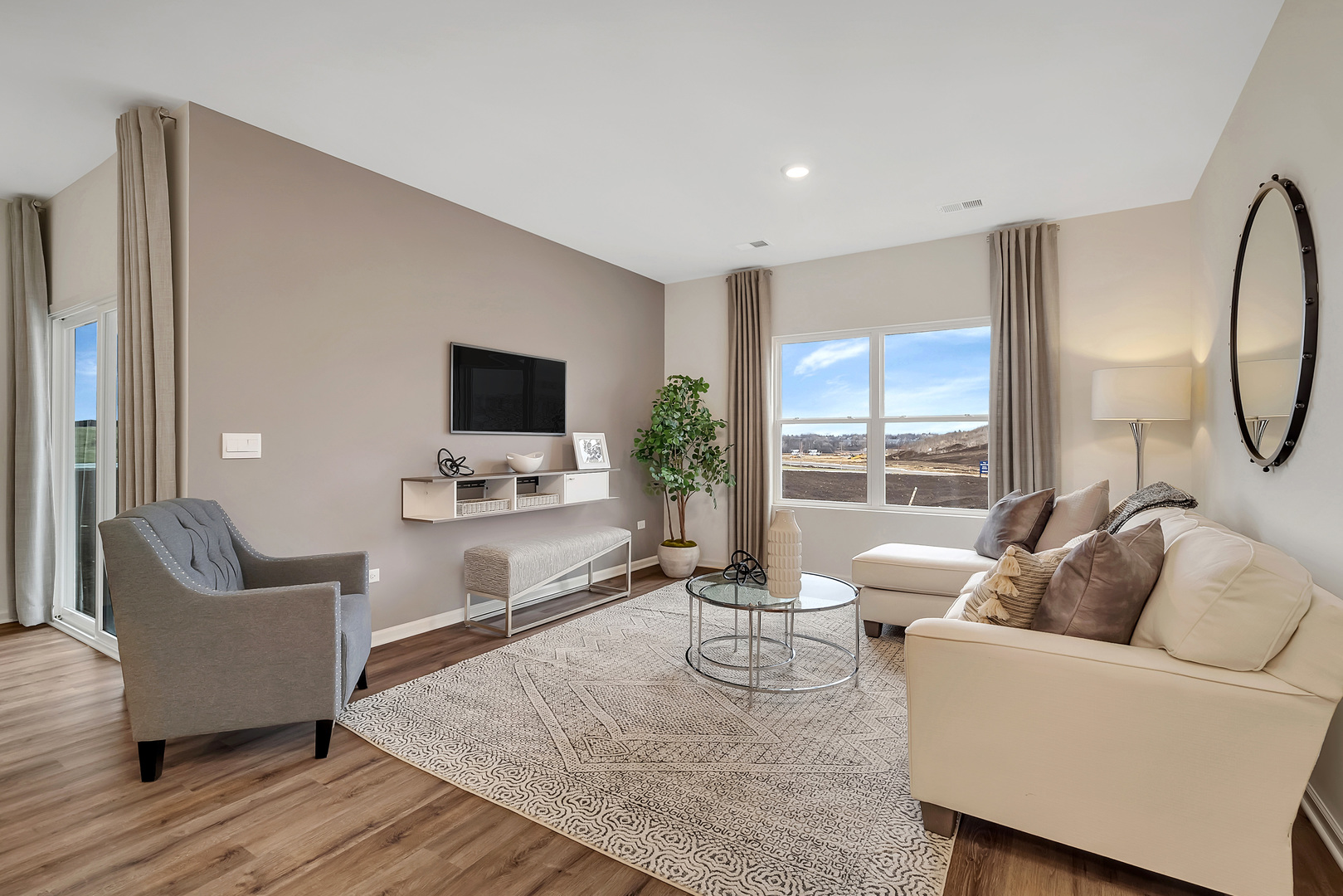1124 Bluebell Lane Bartlett, IL 60103 - Photo 12 of 16 a living room with furniture and a flat screen tv