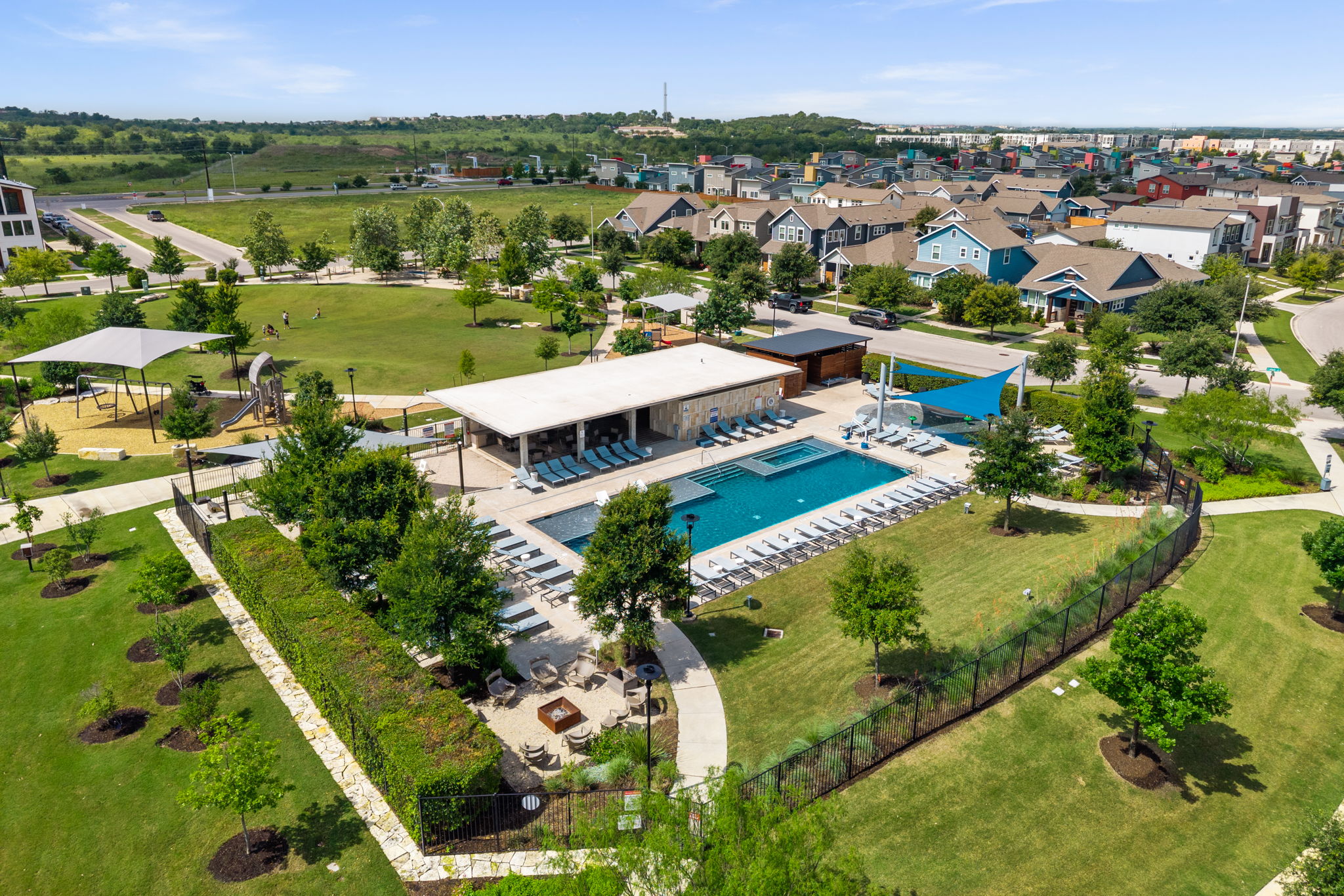 5409 Fox Wing Way Austin, TX 78747 - Photo 24 of 26 An aerial perspective reveals a vibrant community with recreational amenities and residential properties.