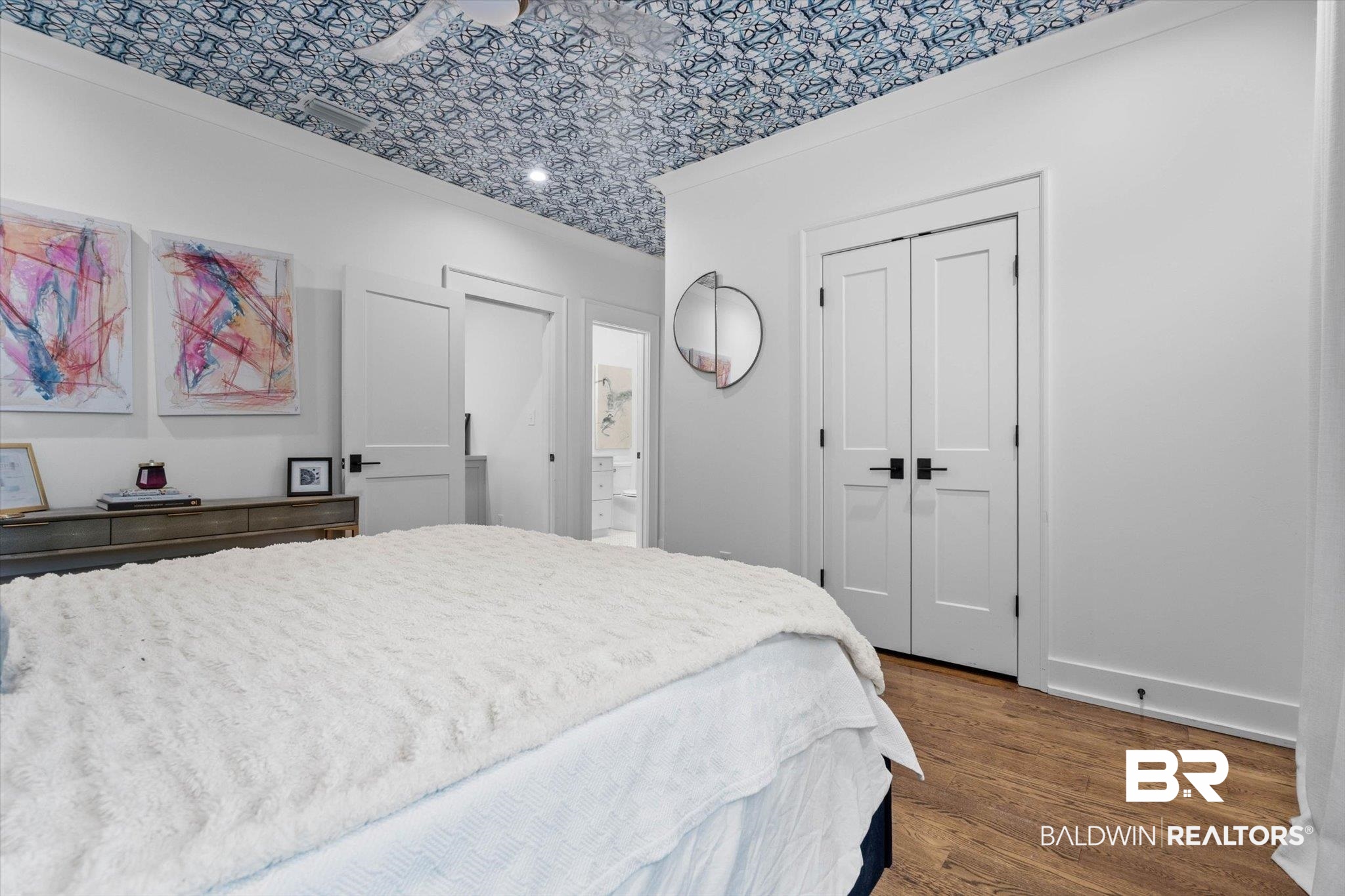4602 Kingswood Drive Mobile, AL 36608 - Photo 30 of 45 Bedroom featuring a closet, dark wood-style flooring, crown molding, and an ornate ceiling