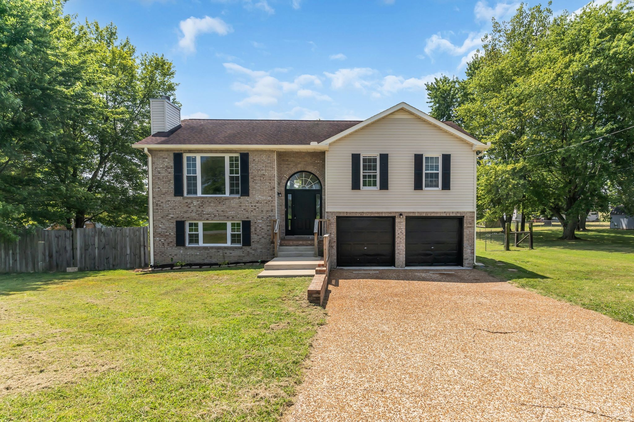 6053 Ebenezer Road Greenbrier, TN 37073 - Photo 1 of 28 a front view of house with yard and trees in the background