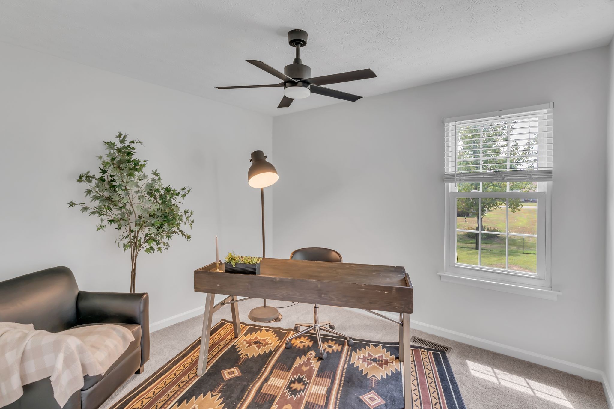 6053 Ebenezer Road Greenbrier, TN 37073 - Photo 14 of 28 a living room with furniture and a potted plant