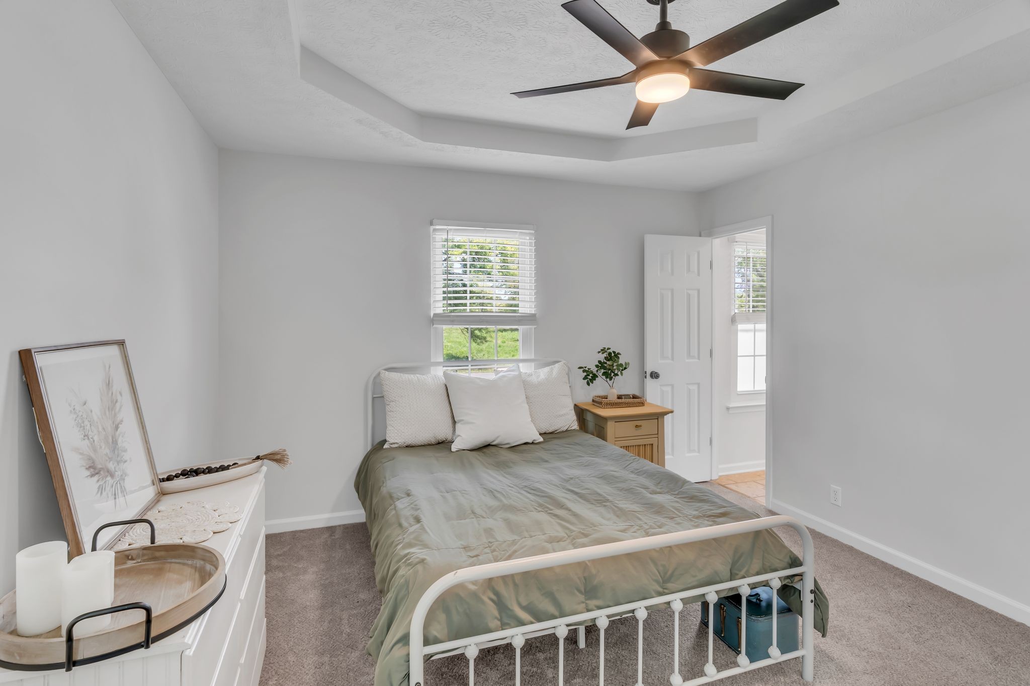 6053 Ebenezer Road Greenbrier, TN 37073 - Photo 17 of 28 a bedroom with a bed and a chandelier