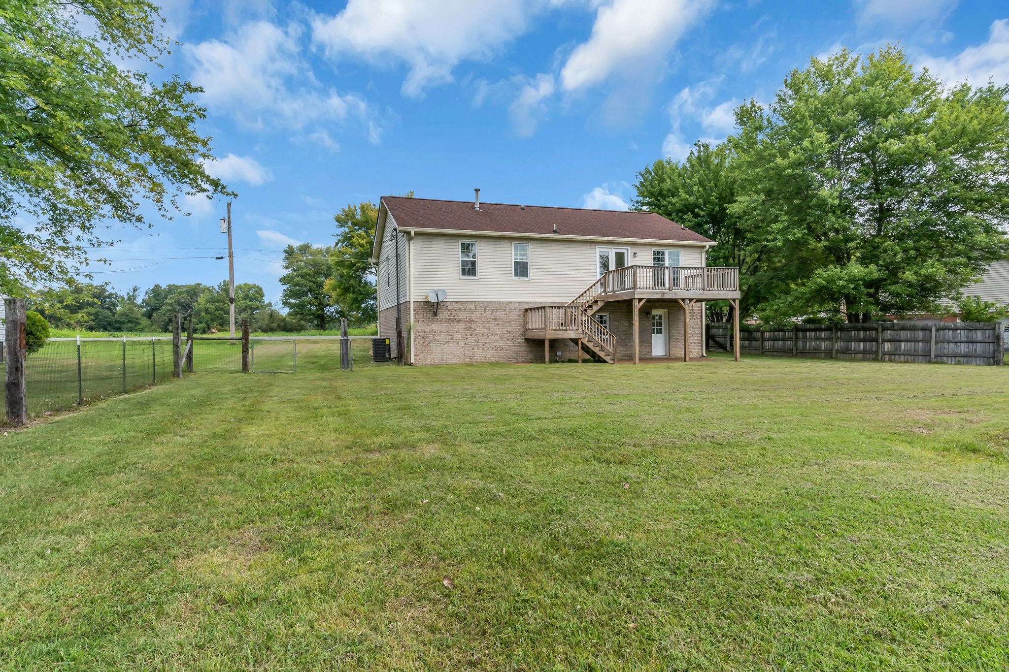 6053 Ebenezer Road Greenbrier, TN 37073 - Photo 25 of 28 a view of a house with a big yard and large trees