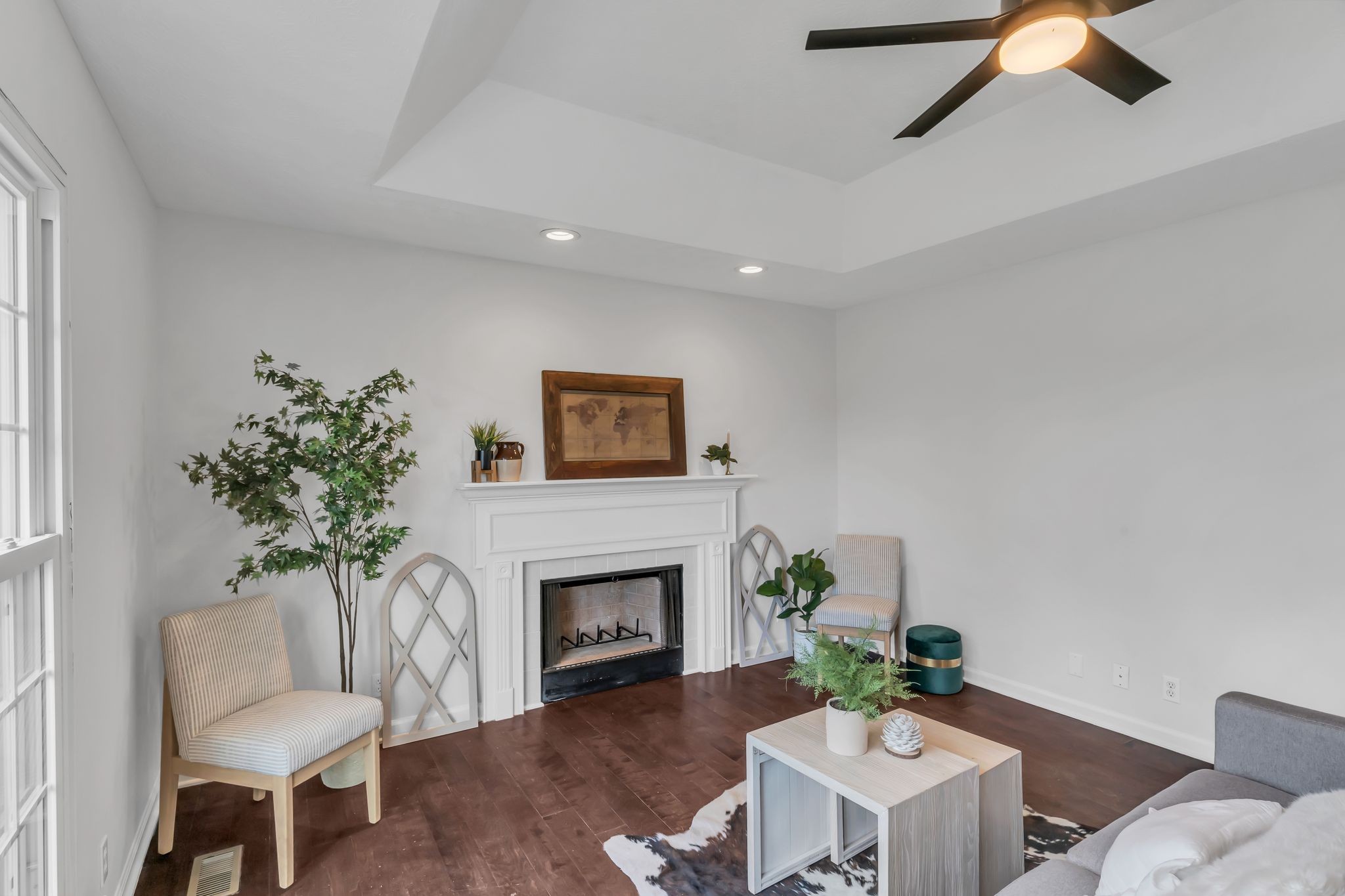6053 Ebenezer Road Greenbrier, TN 37073 - Photo 6 of 28 a living room with furniture a fireplace and a potted plant