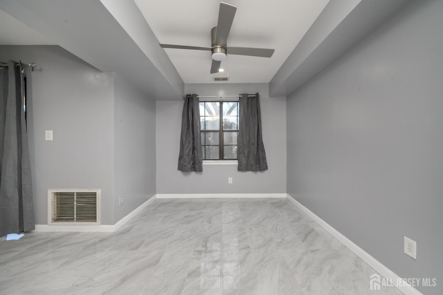 28 Powderhorn Court, Unit A Woodbridge, NJ 07095 - Photo 12 of 26 a view of an empty room with a window