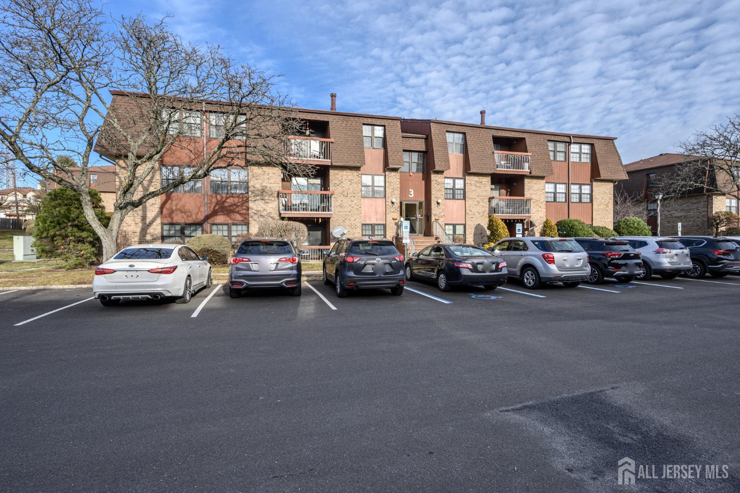 28 Powderhorn Court, Unit A Woodbridge, NJ 07095 - Photo 25 of 26 a view of a city street with parked cars