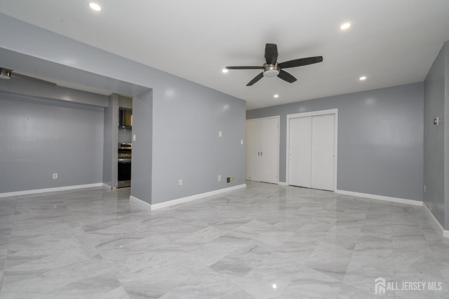 28 Powderhorn Court, Unit A Woodbridge, NJ 07095 - Photo 5 of 26 an empty room with closet and windows