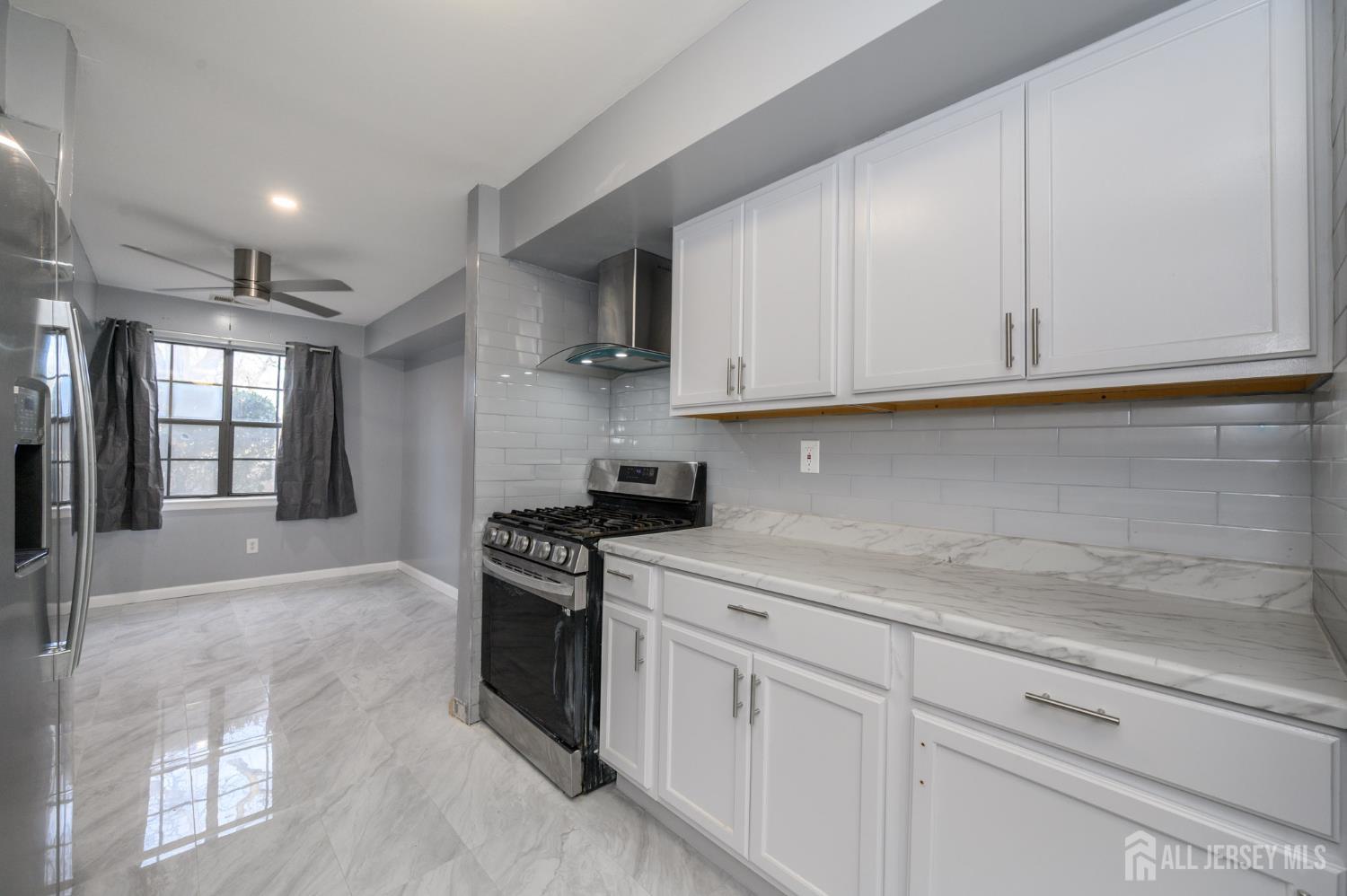 28 Powderhorn Court, Unit A Woodbridge, NJ 07095 - Photo 9 of 26 a kitchen with stainless steel appliances granite countertop a sink stove and cabinets