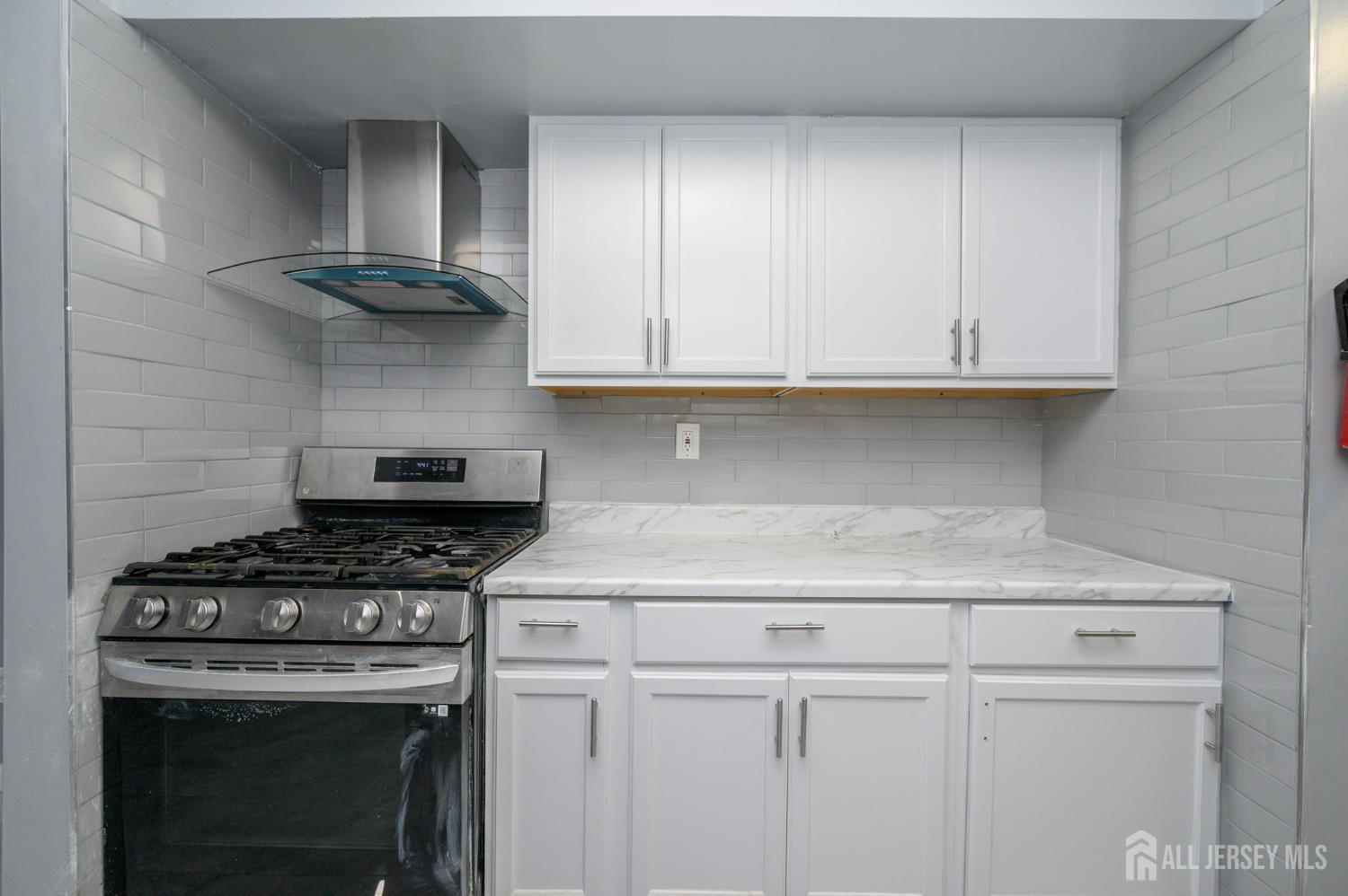 28 Powderhorn Court, Unit A Woodbridge, NJ 07095 - Photo 10 of 26 a kitchen with cabinets appliances and a sink