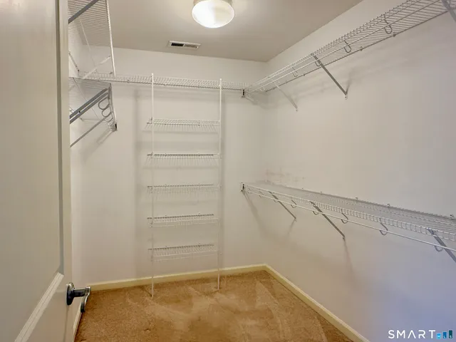 a view of a room with racks on the wall