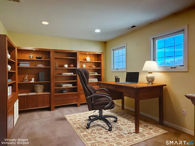 a view of a workspace with furniture