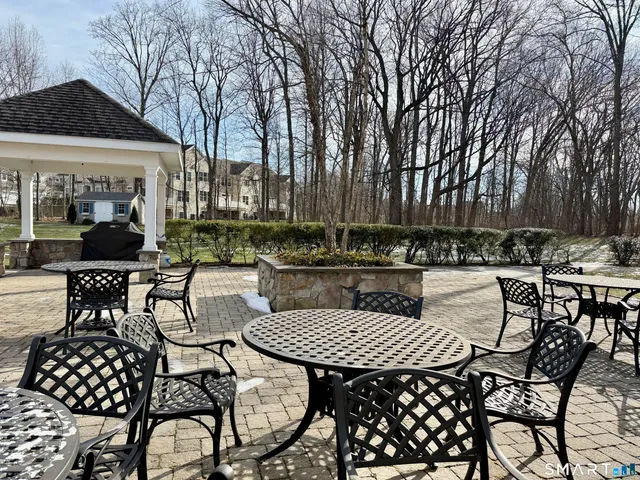 a view of a chairs and table in a patio