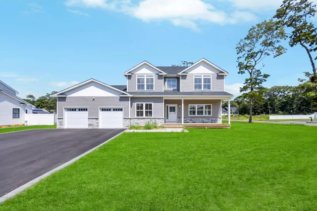 an empty room with a window and a fireplace