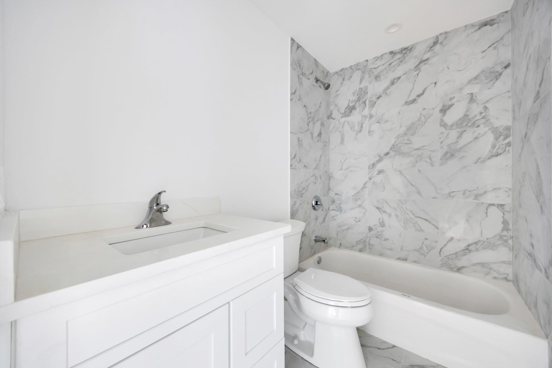Lot #3 Cardinal Court Ridge, NY 11961 - Photo 25 of 31 a bathroom with a sink a toilet and a bathtub