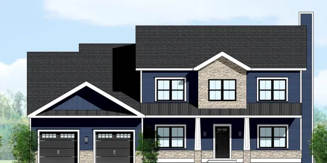 a front view of a residential apartment building with a yard