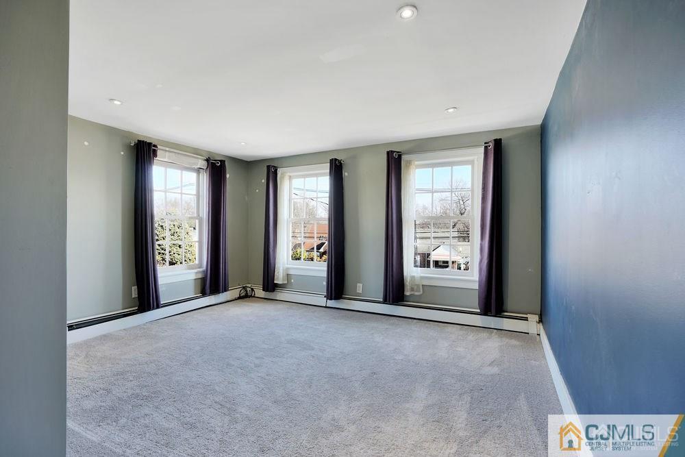 30 Old Post Road Edison, NJ 08817 - Photo 16 of 25 a view of an empty room with large windows