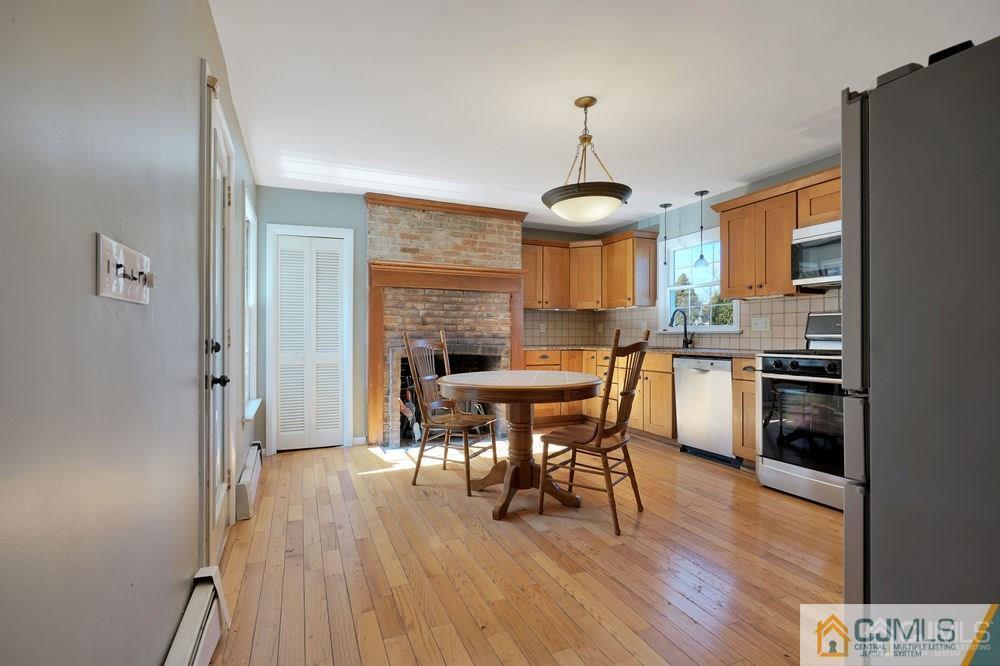 30 Old Post Road Edison, NJ 08817 - Photo 22 of 25 a view of a dining room with furniture and wooden floor