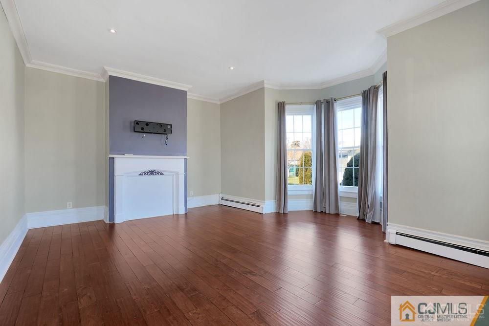 30 Old Post Road Edison, NJ 08817 - Photo 8 of 25 a view of a room with wooden floor and a window
