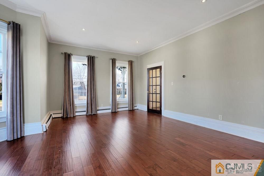 30 Old Post Road Edison, NJ 08817 - Photo 10 of 25 an empty room with wooden floor and windows