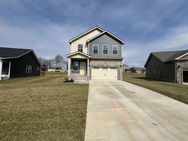 a front view of a house with a yard