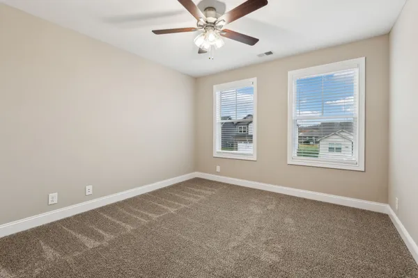 a large kitchen with stainless steel appliances lots of counter space and a sink