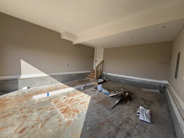 a view of kitchen with sink and refrigerator