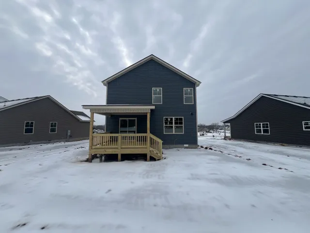 a kitchen with sink microwave and refrigerator