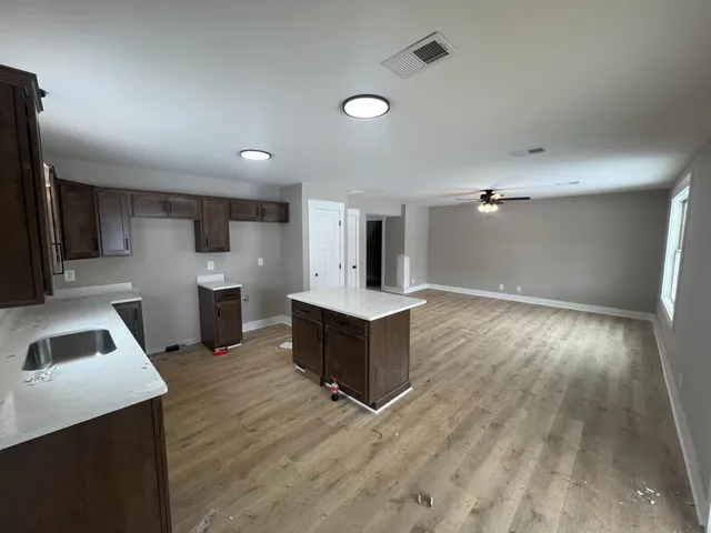 a view of hallway with an empty room