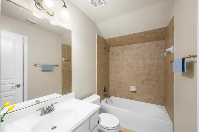 a bathroom with a sink vanity and a mirror