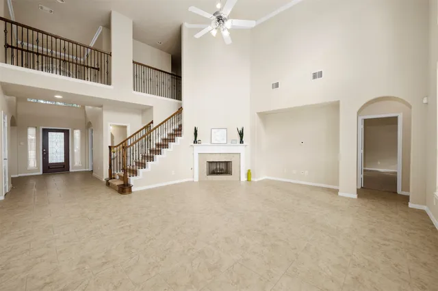 a view of an empty room with a fireplace