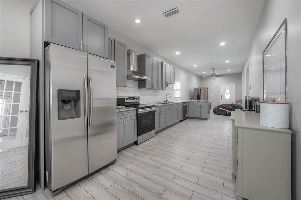 2341 West Chestnut Street Tampa, FL 33607 - Photo 13 of 42 a large kitchen with stainless steel appliances lots of counter top space and refrigerator