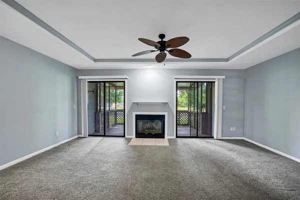 a view of a room with a fireplace and a window