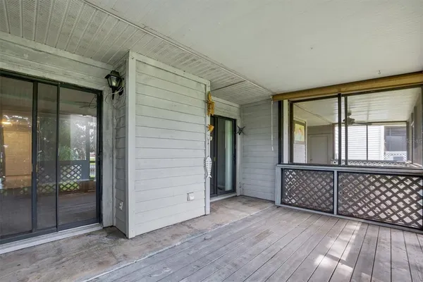 a view of a balcony with wooden floor