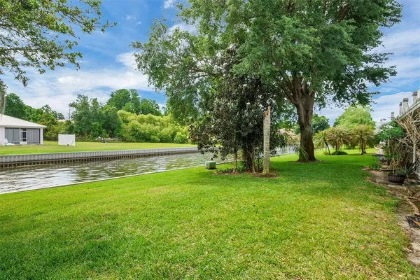 a view of residential houses with outdoor space and lake view
