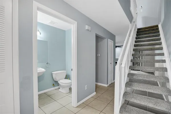 a view of bathroom with a toilet and a view of bathroom