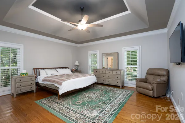 a bedroom with a bed and a couch