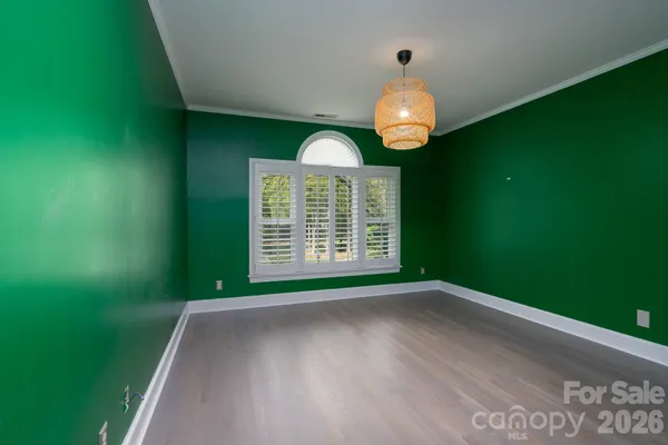 a view of a room with window wooden floor and a outdoor space