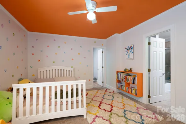 a bedroom with furniture and wooden floor