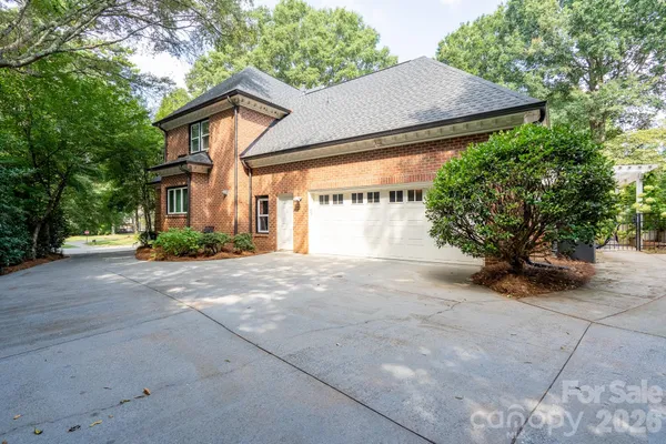 a view of a house with a yard and garage