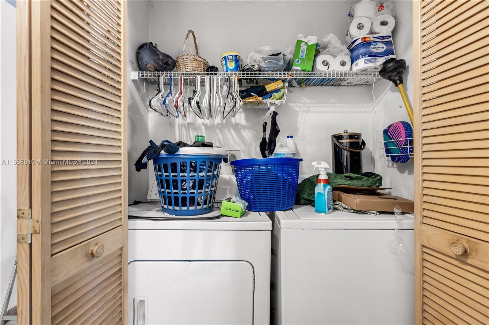 14807 Balgowan Road, Unit 10212 Miami Lakes, FL 33016 - Photo 12 of 32 a kitchen with a refrigerator and a sink