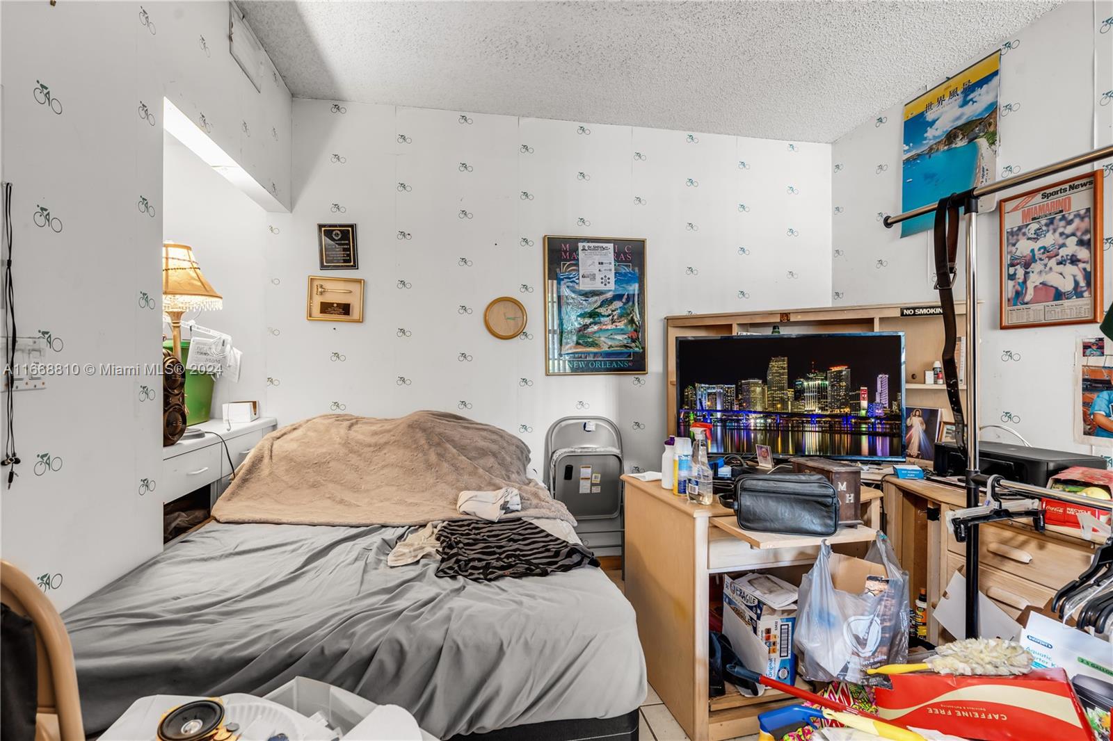 14807 Balgowan Road, Unit 10212 Miami Lakes, FL 33016 - Photo 14 of 32 a bedroom with bed and a couch