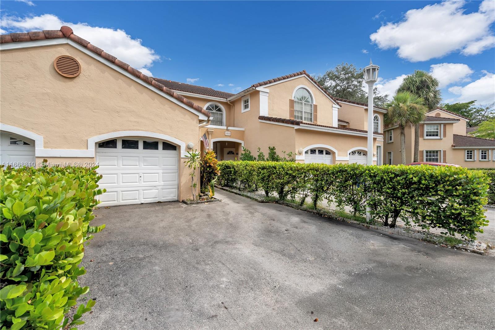 14807 Balgowan Road, Unit 10212 Miami Lakes, FL 33016 - Photo 20 of 32 a view of a house with a backyard