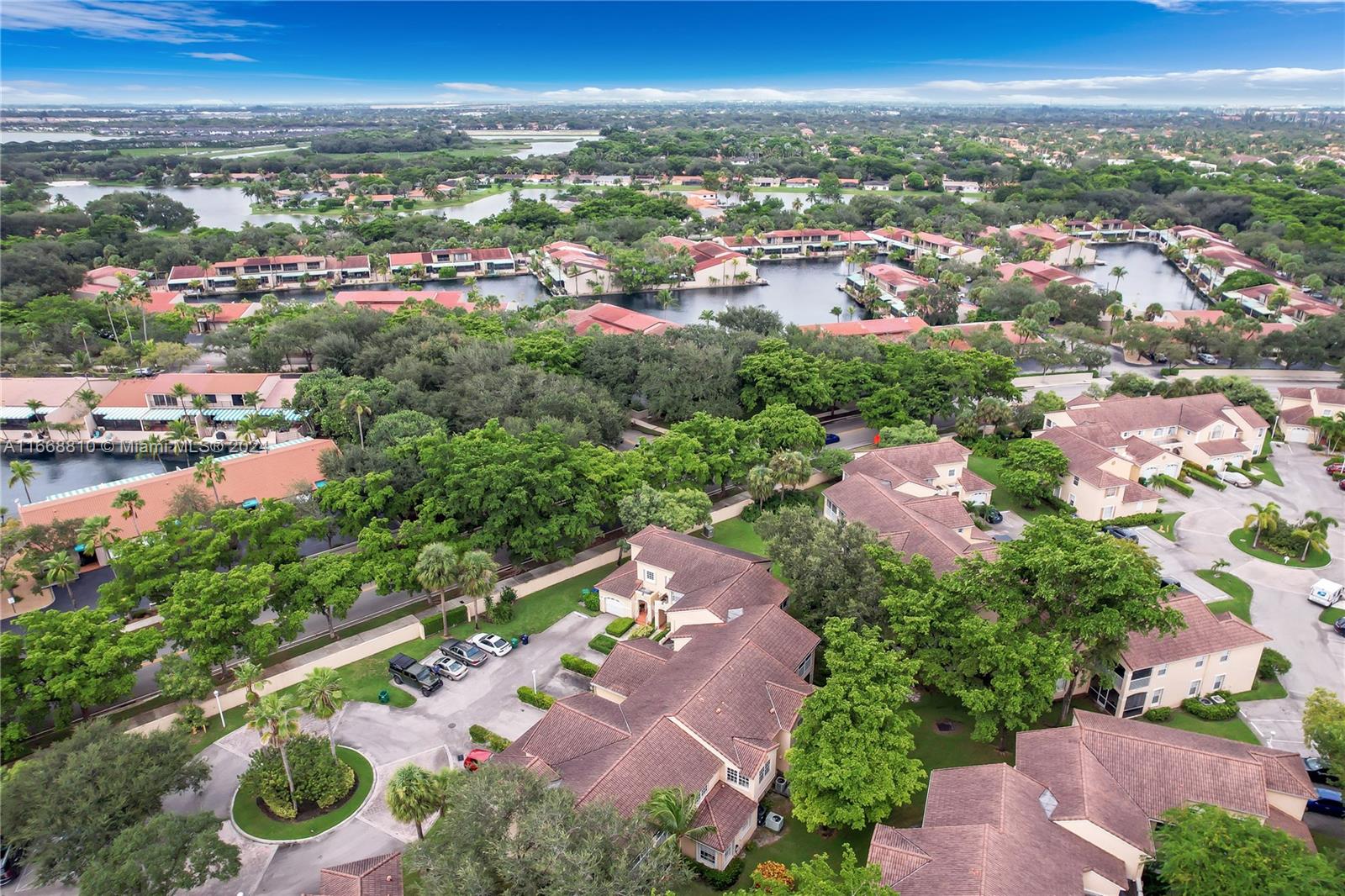 14807 Balgowan Road, Unit 10212 Miami Lakes, FL 33016 - Photo 29 of 32 an aerial view of residential houses with outdoor space